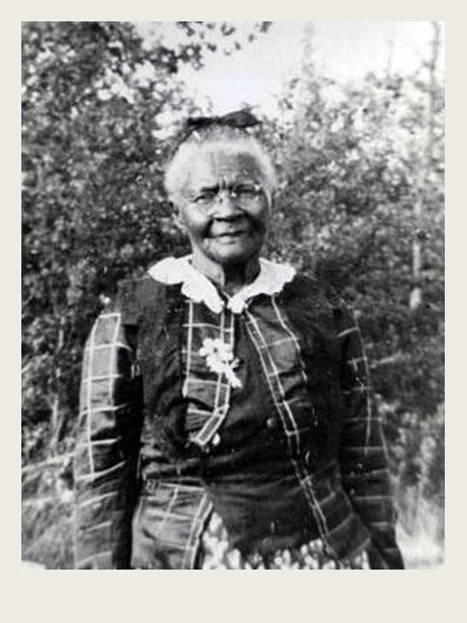 A man is selling newspapers. The newspaper says ‘The Globe and Mail – Canada Declares War’ on the front of it.