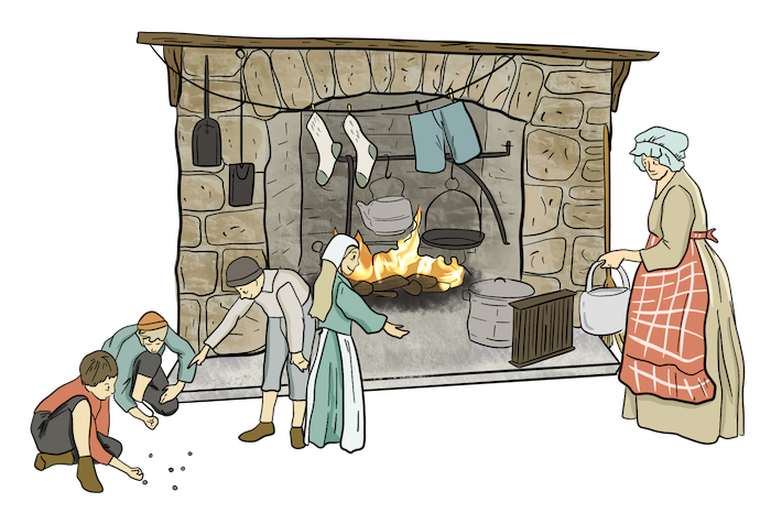 A fire is lit inside of a fireplace. The fire is used to cook food, heat water in a kettle, and dry clothes that are hanging on a clothes line. A mom is working to cook food, while kids play closeby. 