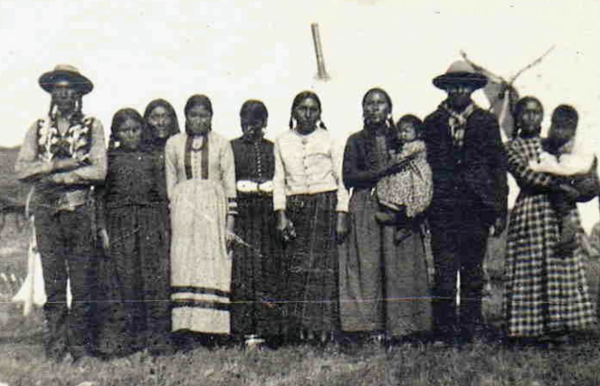 A group of First Nations people are posing together for a photo.