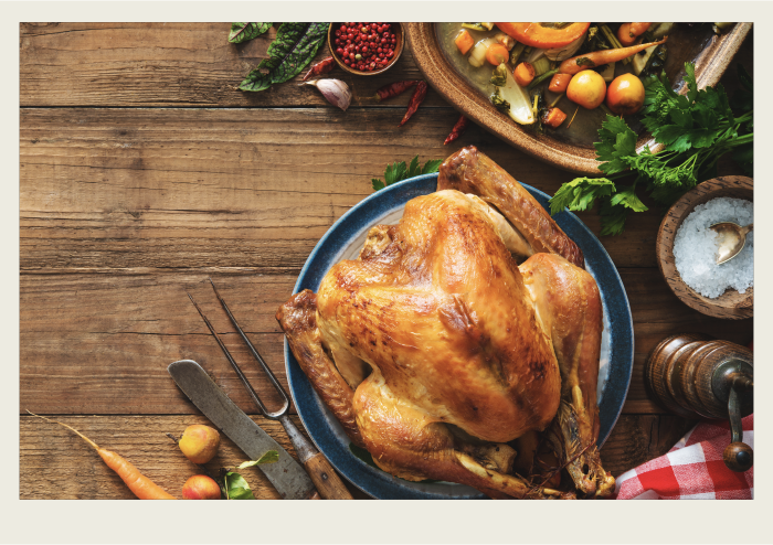 Photo caps-03 A Christmas dinner table is shown with a roasted turkey, amongst other dishes.