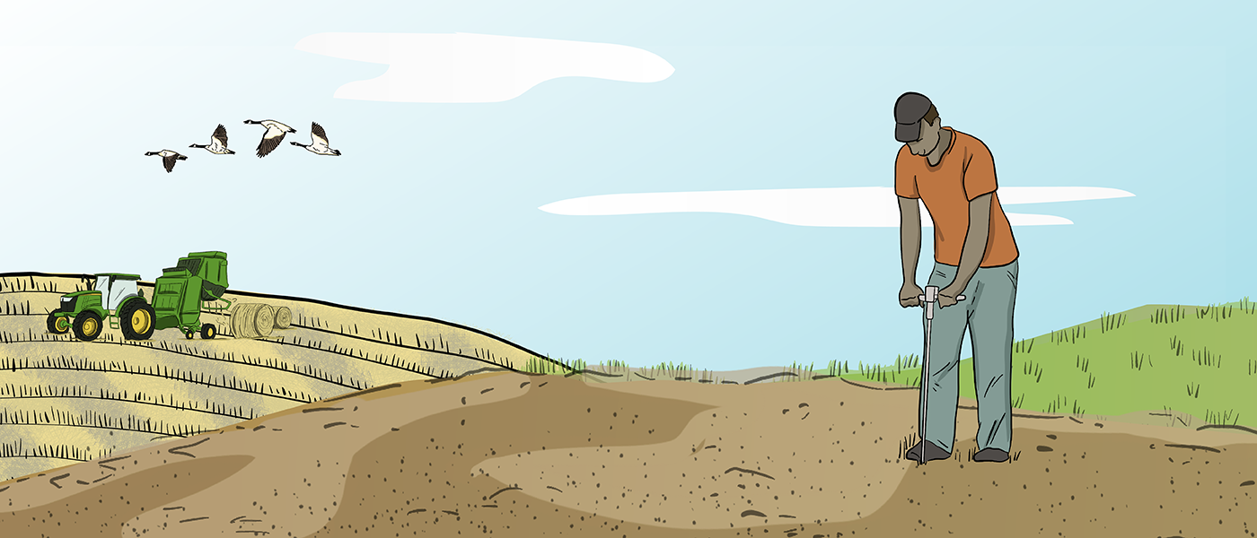 An illustrated farmer uses a moisture tester in the soil with a tractor and baler in the background on a farm field.