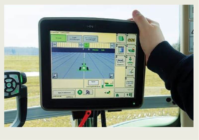 A monitor with autosteer technology on screen is shown.