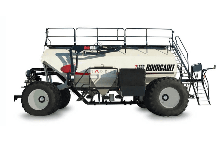 A large air seeder is shown with the words ‘71300 Bourgault’ on the side of it.