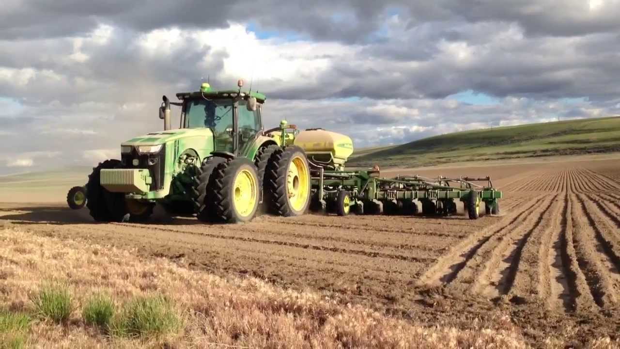 A tractor is stopped with no driver in the cab.