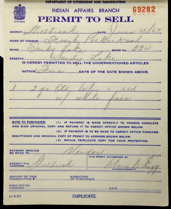 An aged ‘Permit to Sell’ paper with hand-writing on it.