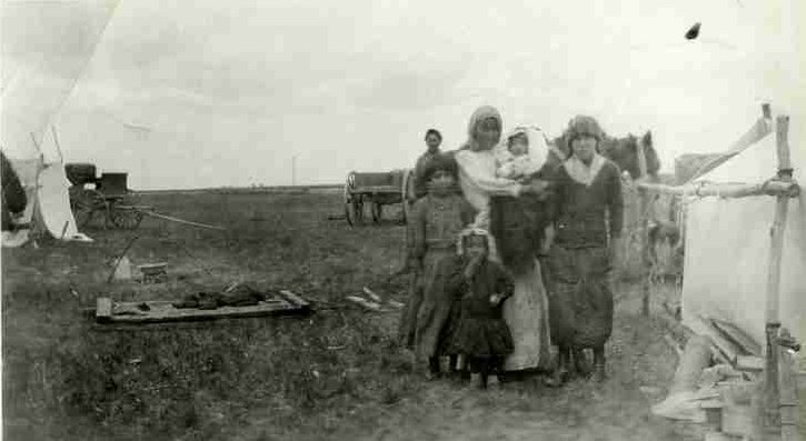 First Nations stone pickers work in a field near Davidson, SK