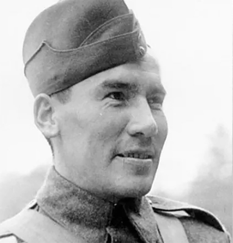An Indigenous soldier named Sergeant Harvey Dreaver smiles with a uniform on. The caption under the photo reads: Sergeant Harvey Dreaver, son of Chief Joe Dreaver of the Mistawasis Band, was killed in action during the battle at the Leopold Canal and is buried at Adegem Canadian War Cemetery in Belgium. -Doris Rowe.