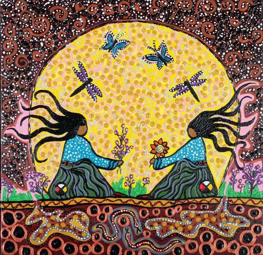 A piece of art by Leah Marie Dorion made with mosaics shows two Indigenous women facing each other with their hair blowing out behind them. There is a sun with butterflies in the centre, and snakes underneath the ground.