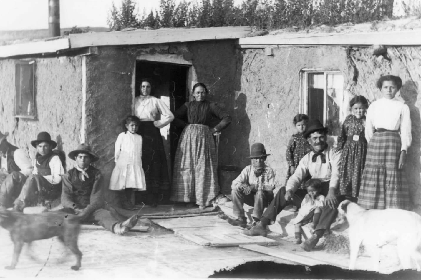 A piece of art by Leah Marie Dorion made with mosaics shows two Indigenous women facing each other with their hair blowing out behind them. There is a sun with butterflies in the centre, and snakes underneath the ground.