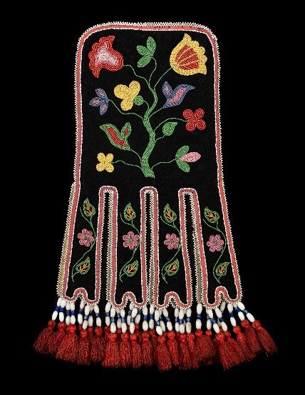 A piece of art by Leah Marie Dorion made with mosaics shows two Indigenous women facing each other with their hair blowing out behind them. There is a sun with butterflies in the centre, and snakes underneath the ground.