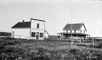 A piece of art by Leah Marie Dorion made with mosaics shows two Indigenous people standing near animals, sun, and water. 