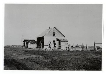 A piece of art by Leah Marie Dorion made with mosaics shows two Indigenous women facing each other with their hair blowing out behind them. There is a sun with butterflies in the centre, and snakes underneath the ground.